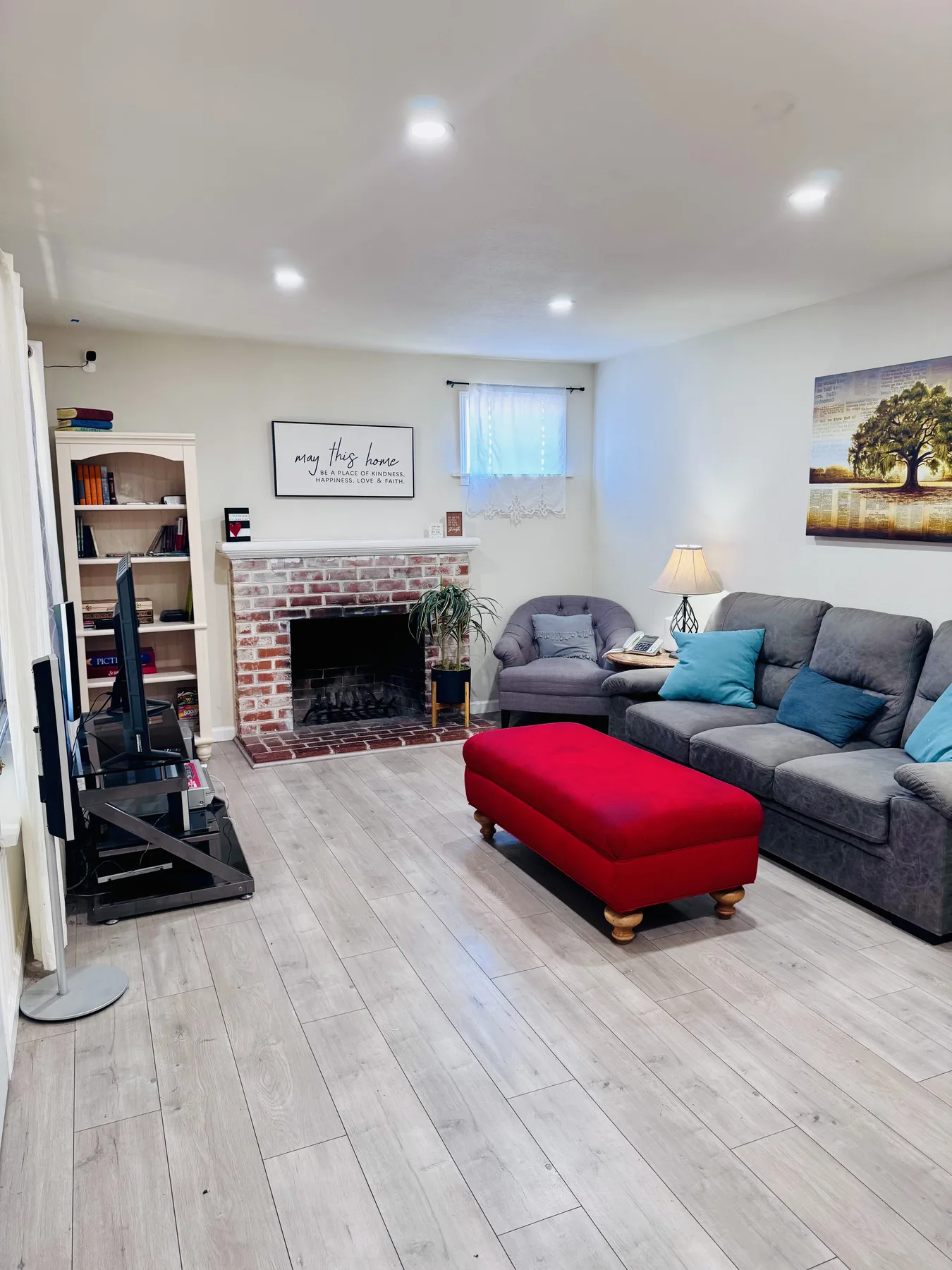 Shared living room with seating and a fireplace